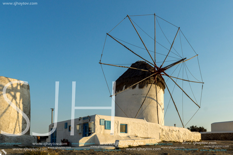 Amazing Sunset and White windmills on the island of Mykonos, Cyclades, Greece