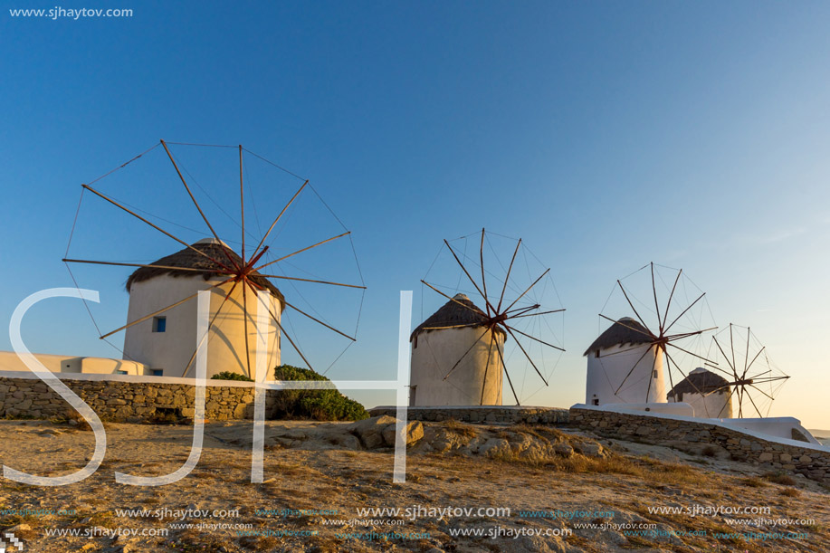 Sunset view of White windmills on the island of Mykonos, Cyclades, Greece