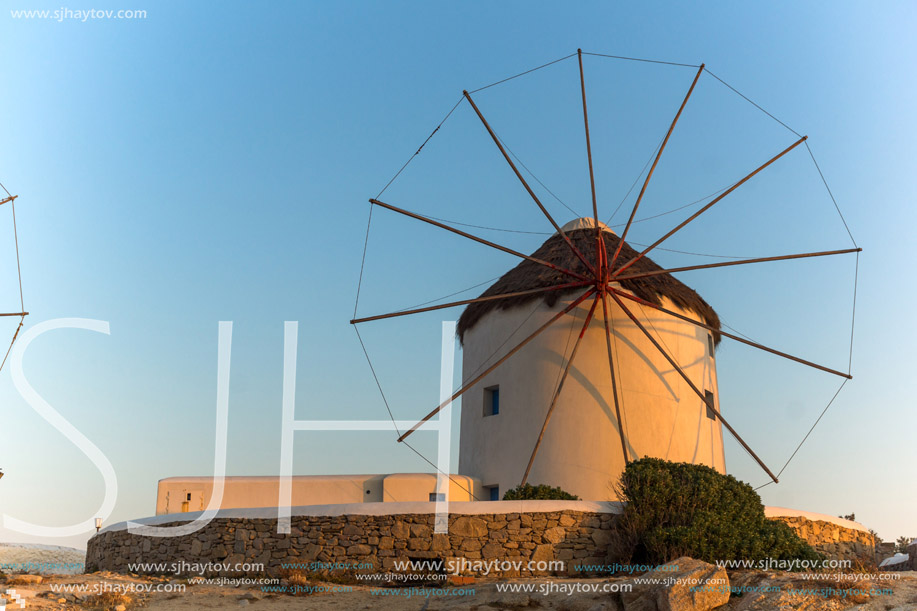 Sunset over White windmills on the island of Mykonos, Cyclades, Greece