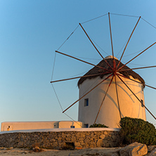 Sunset over White windmills on the island of Mykonos, Cyclades, Greece