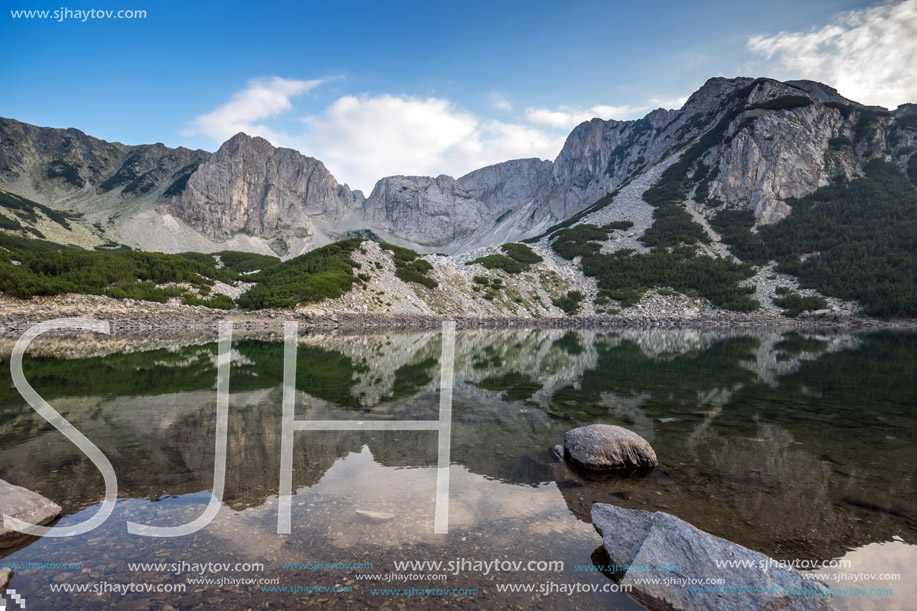 Landscape with Dark Clouds over Sinanitsa Peak and reflectionin the lake, Pirin Mountain, Bulgaria