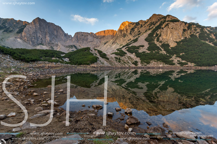 Amazing Sunrise with Colored in red rock of Sinanitsa peak and  the lake, Pirin Mountain, Bulgaria