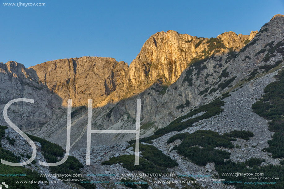 Sunrise with red rocks of Sinanitsa peak and  the lake, Pirin Mountain, Bulgaria