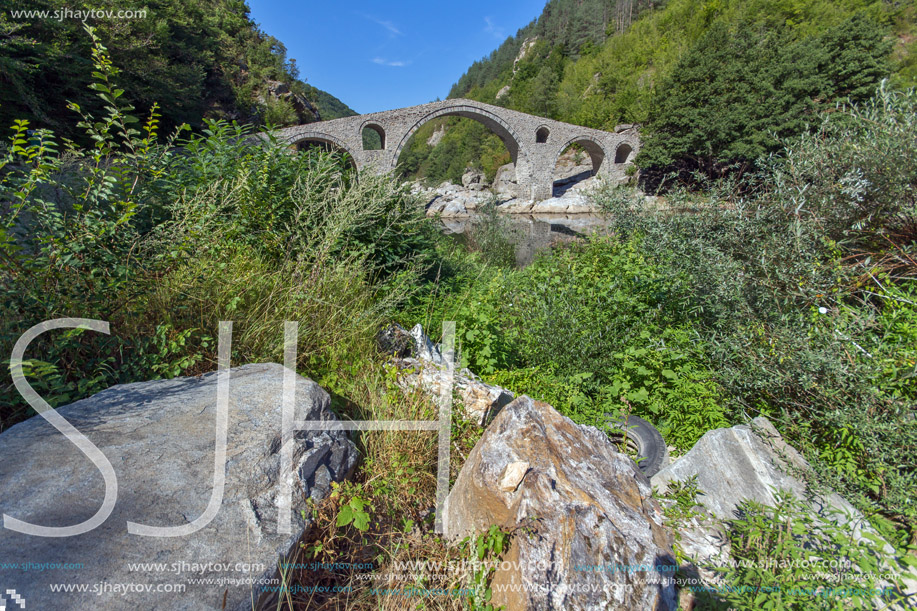 Reflection of Devil"s Bridge in Arda river and Rhodopes mountain, Kardzhali Region, Bulgaria