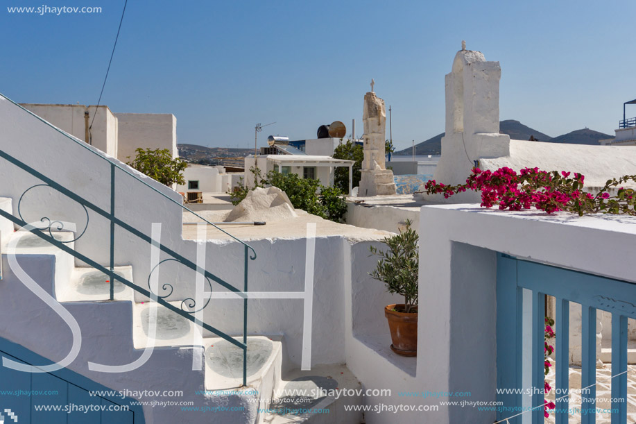 Small white church with flowers in town of Parakia, Paros island, Cyclades, Greece