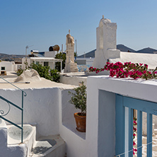 Small white church with flowers in town of Parakia, Paros island, Cyclades, Greece