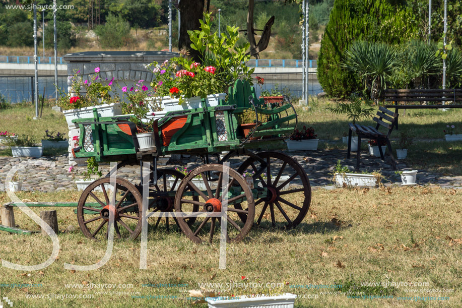 Wagon covered with flowers in the yard in Monastery St. John the Baptist, Kardzhali,  Bulgaria