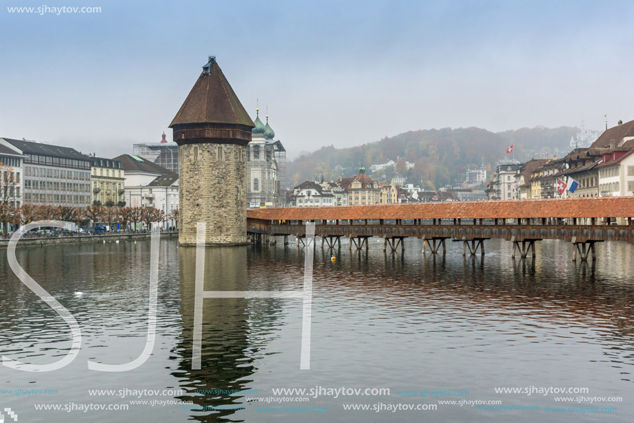 foggy morning and Chapel Bridge over Reuss River, Lucerne, Switzerland