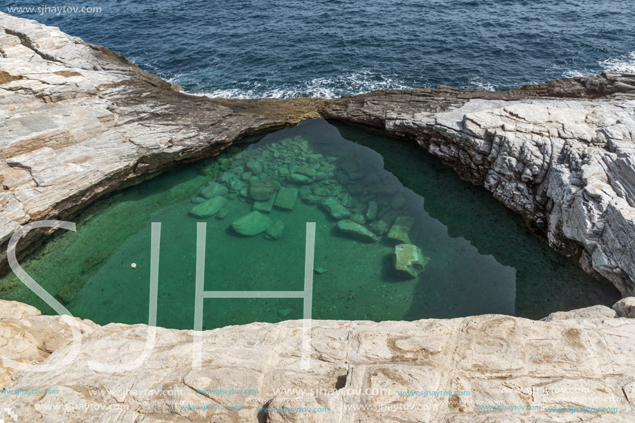 Green waters of Giola Natural Pool in Thassos island, East Macedonia and Thrace, Greece