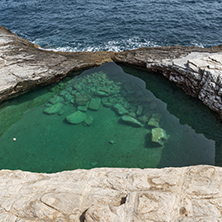 Green waters of Giola Natural Pool in Thassos island, East Macedonia and Thrace, Greece