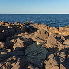 Panoramic sunset view of rocks at coastline of Sozopol town and black sea, Burgas Region, Bulgaria