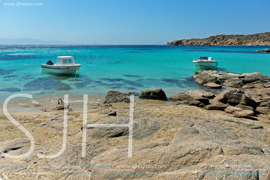 Small boat in Paranga Beach on the island of Mykonos, Cyclades, Greece