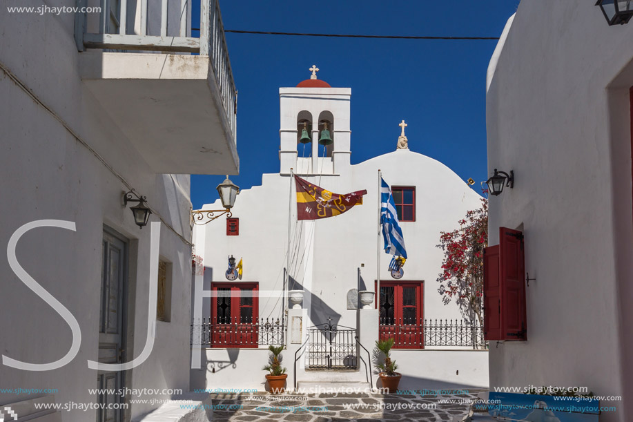 White orthodox church and small bell tower in Mykonos, Cyclades Islands, Greece