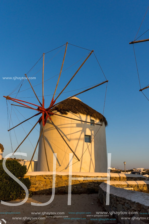 Sunset over White windmills on the island of Mykonos, Cyclades, Greece