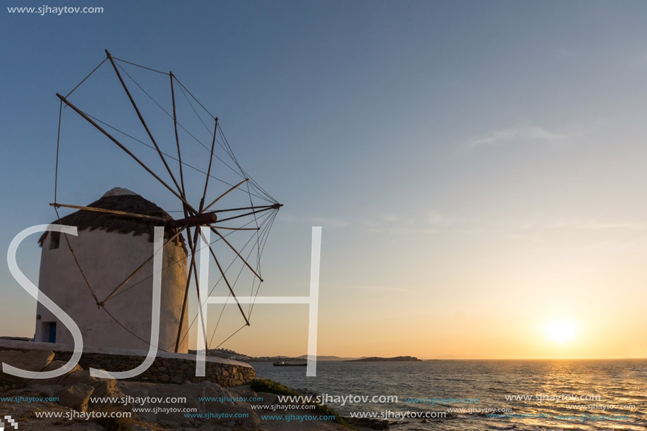 Amazing Sunset and White windmills on the island of Mykonos, Cyclades, Greece