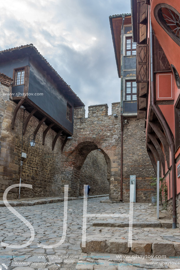 Night photo of old houes and ancient fortress entrance of old town of city of Plovdiv, Bulgaria