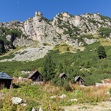 Rock and small wooden charlet in  Rila Mountain, Bulgaria