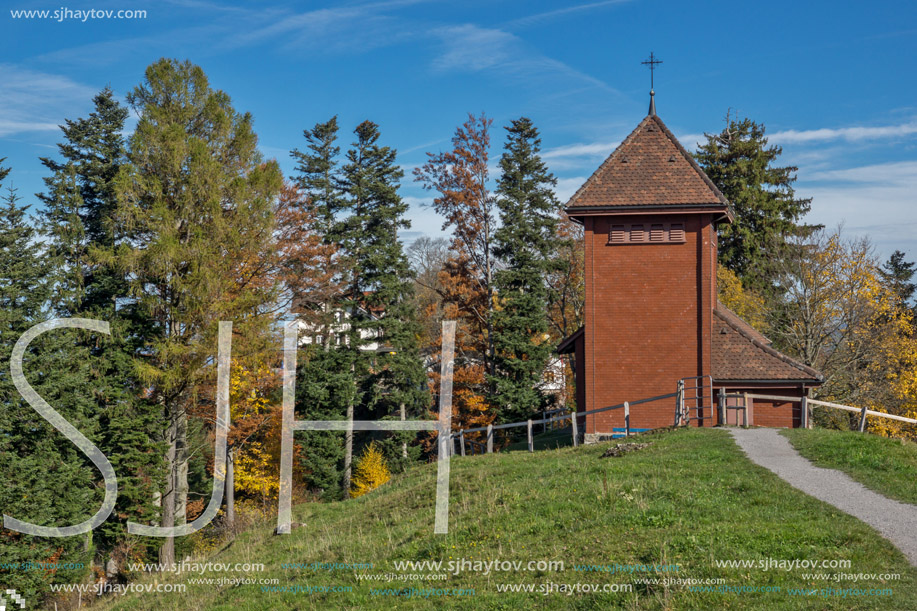 Old church and autumn trees near mount Rigi, Alps, Switzerland