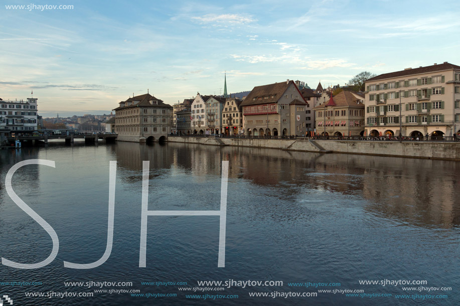 Sunset panorama of city of Zurich and reflection in Limmat River, Switzerland