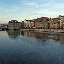 Sunset panorama of city of Zurich and reflection in Limmat River, Switzerland