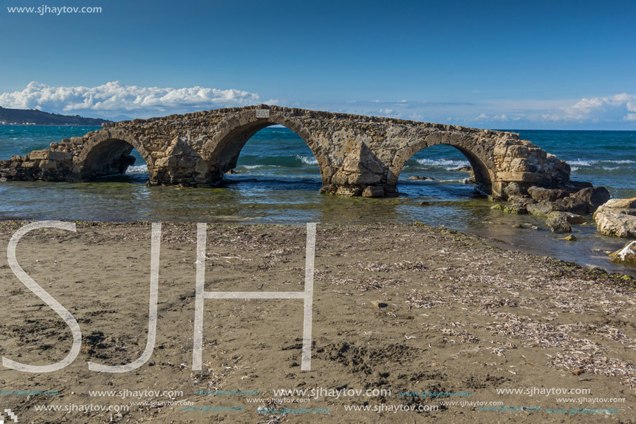 Seascape with medieval bridge in the water at Argassi beach, Zakynthos island, Greece