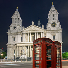 Night photo phone booth and St. Paul"s Cathedral in London, Great Britain