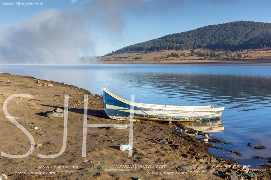 Old boat at the coastline of Batak Reservoir, Pazardzhik Region, Bulgaria