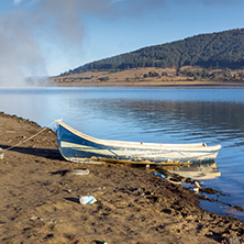 Old boat at the coastline of Batak Reservoir, Pazardzhik Region, Bulgaria