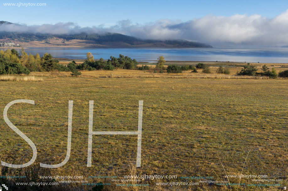 Low clouds over water of Batak Reservoir, Pazardzhik Region, Bulgaria