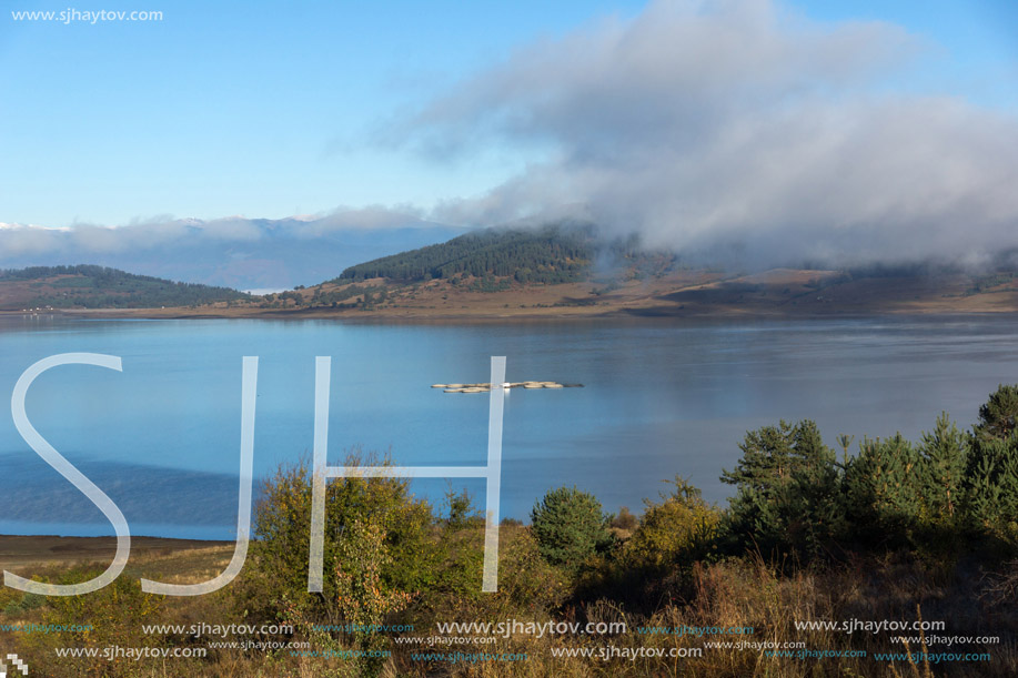 Landscape with Low clouds over water of Batak Reservoir, Pazardzhik Region, Bulgaria