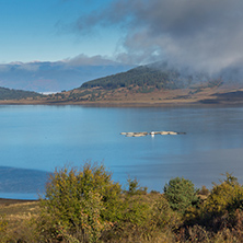 Amazing Autumn Landscape with Low clouds over water of Batak Reservoir, Pazardzhik Region, Bulgaria