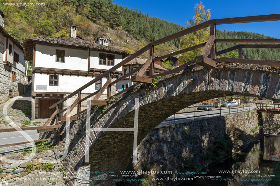 Autumn Landscape with Roman Bridge and old houses in town of Shiroka Laka, Smolyan Region, Bulgaria