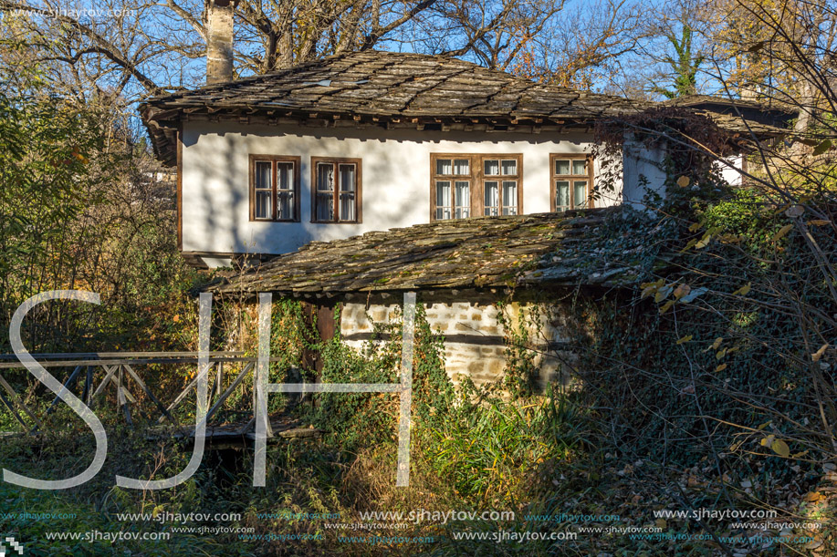 Panoramic view with Old house with wooden fence in village of Bozhentsi, Gabrovo region, Bulgaria