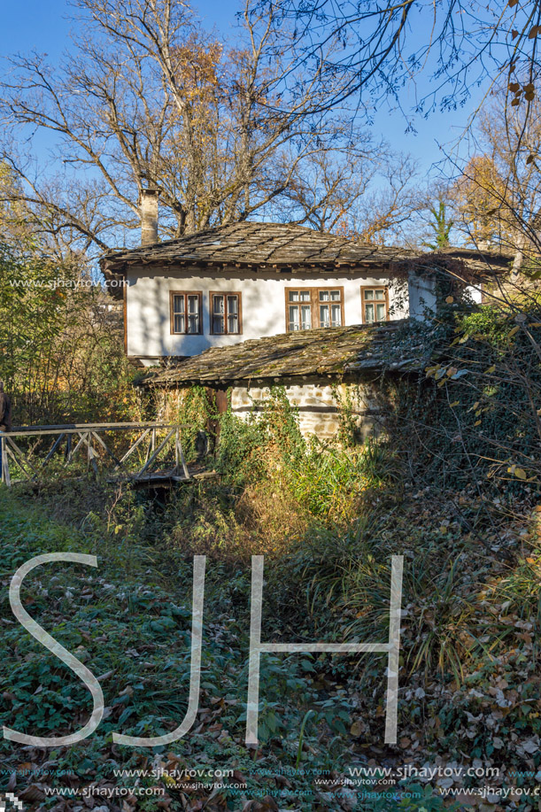 Landscape with wooden Bridge and old house in village of Bozhentsi, Gabrovo region, Bulgaria