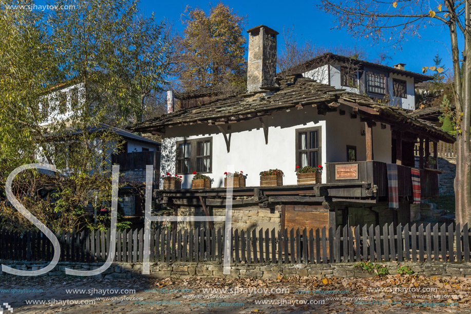 Old house with wooden fence in  village of Bozhentsi, Gabrovo region, Bulgaria