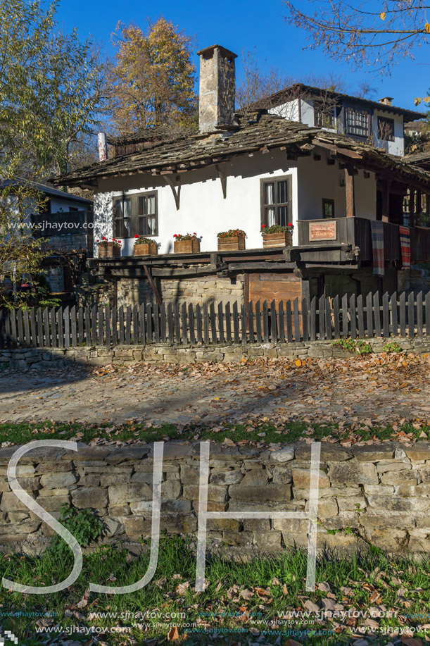 Panorama with Old house with wooden fence in  village of Bozhentsi, Gabrovo region, Bulgaria