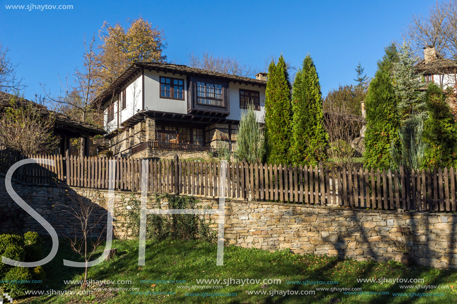 Panoramic view with Old house with wooden fence in village of Bozhentsi, Gabrovo region, Bulgaria