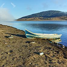 Boat at the coastline of Batak Reservoir, Pazardzhik Region, Bulgaria