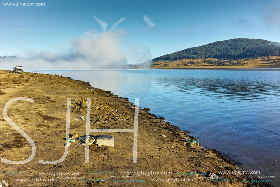 Low clouds over water of Batak Reservoir, Pazardzhik Region, Bulgaria