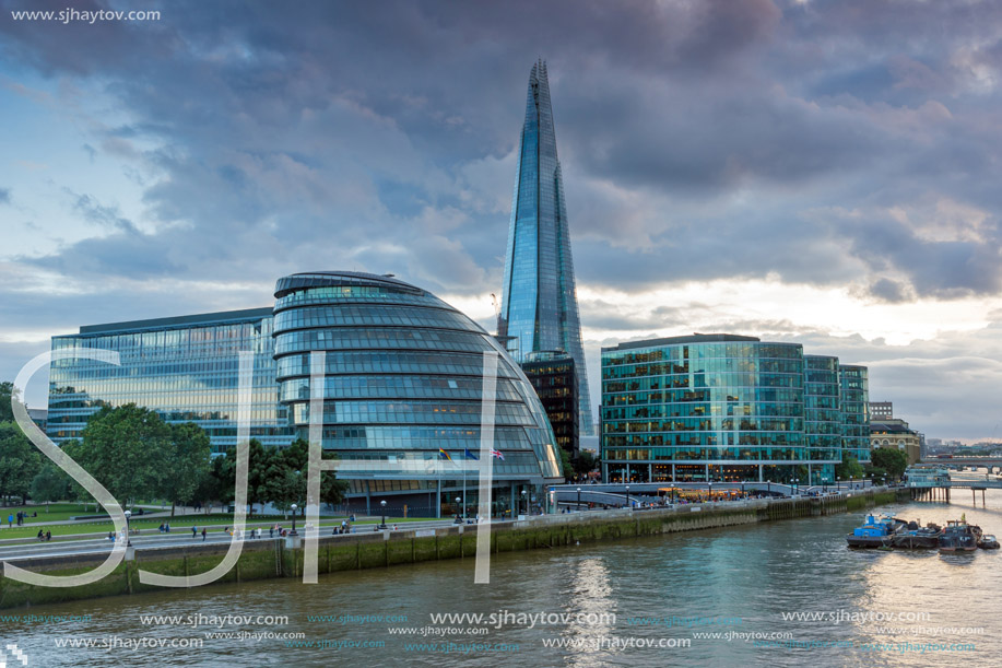 LONDON, ENGLAND - JUNE 15 2016: Amazing Sunset photo of The Shard skyscraper and City Hall from Thames river, England, Great Britain