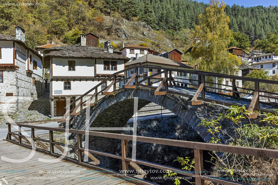 Autumn Landscape with Roman Bridge and Church of the Assumption in town of Shiroka Laka, Smolyan Region, Bulgaria