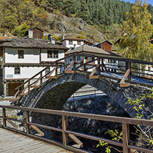 Autumn Landscape with Roman Bridge and Church of the Assumption in town of Shiroka Laka, Smolyan Region, Bulgaria