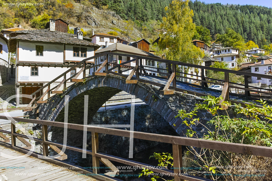 Autumn Landscape with Roman Bridge and old houses in town of Shiroka Laka, Smolyan Region, Bulgaria