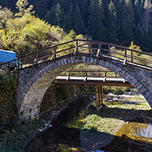 Autumn Landscape with Roman Bridge and Church of the Assumption in town of Shiroka Laka, Smolyan Region, Bulgaria