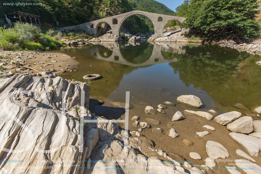 Reflection of The Devil"s Bridge in Arda river and Rhodopes mountain, Kardzhali Region, Bulgaria