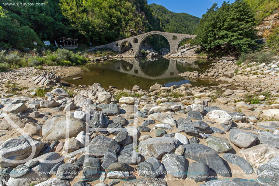 Reflection of The Devil"s Bridge and Rhodopes mountain in Arda river, Kardzhali Region, Bulgaria