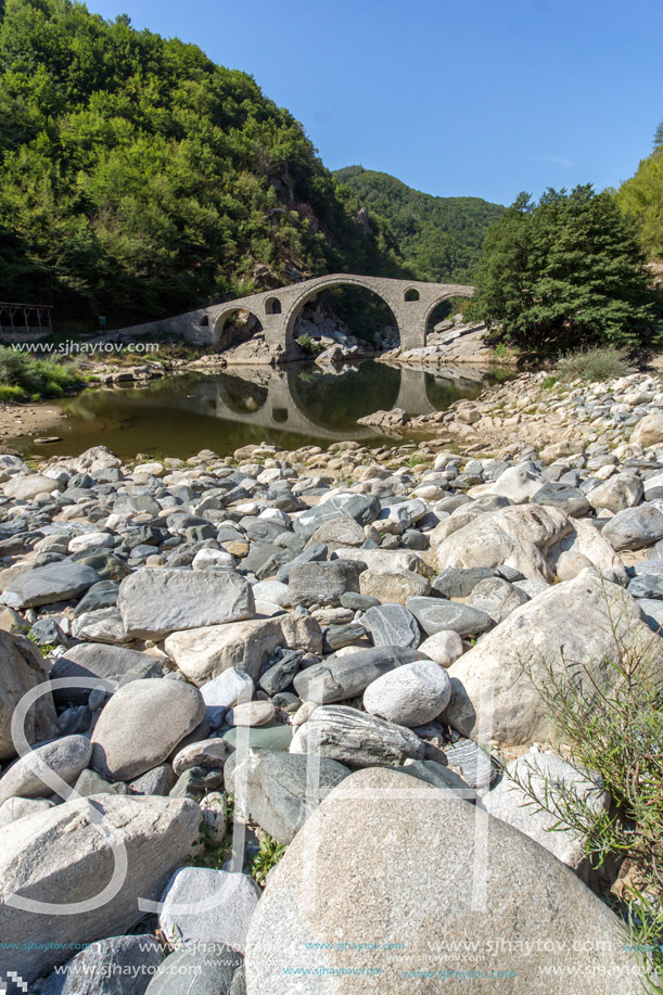 Reflection of The Devil"s Bridge and Rhodopes mountain in Arda river, Kardzhali Region, Bulgaria