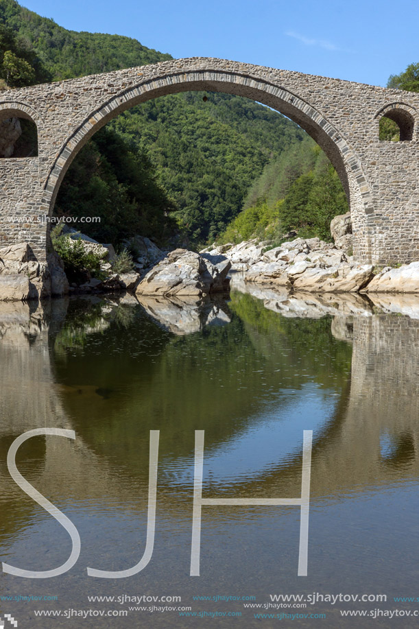 Reflection of Devil"s Bridge and Rhodopes mountain in Arda river, Kardzhali Region, Bulgaria