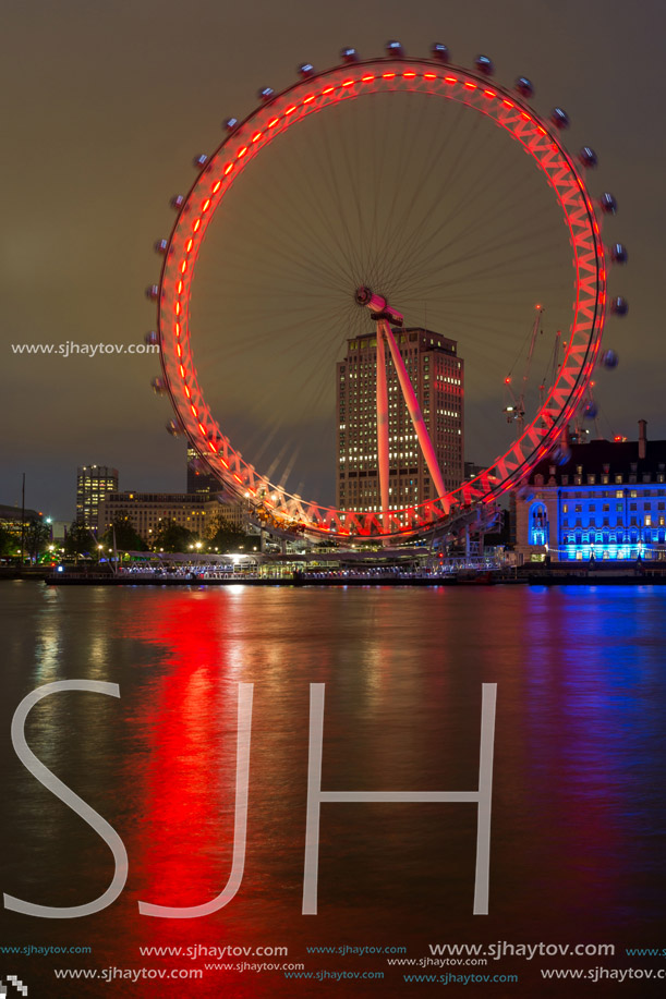 LONDON, ENGLAND - JUNE 16 2016: Night photo of The London Eye and County Hall, Westminster, London, England, Great Britain