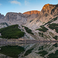 Sunrise with Colored in red rock of Sinanitsa peak and  the lake, Pirin Mountain, Bulgaria